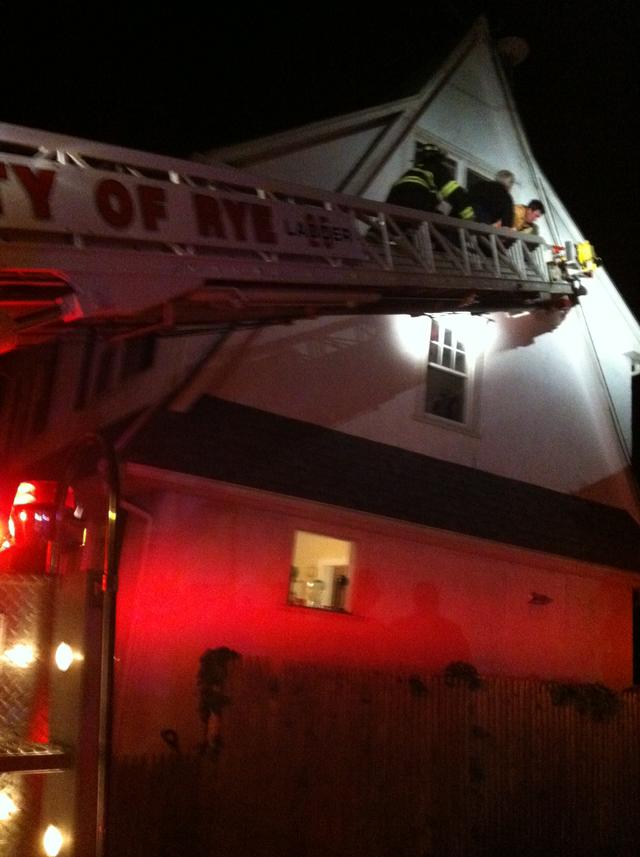 Firefighters assist PD and EMS with removing a fully immobilized patient from a third floor window 5/29/13 